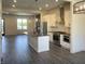 Open-concept kitchen with stainless steel appliances, modern white cabinets, and center island at 373 S Cherry St, Westfield, IN 46074