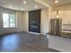Open-concept living area with fireplace, stainless steel appliances, and stylish decor at 373 S Cherry St, Westfield, IN 46074