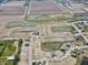 Aerial view showing a new development with houses, ponds, and undeveloped lots at 5139 Cartland Dr, Indianapolis, IN 46239