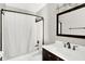 Bathroom with tub, shower, dark wood vanity, and white countertop and sink at 5327 Milhouse Rd, Indianapolis, IN 46221