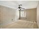 Bedroom with ceiling fan and patterned wallpaper at 6908 Creekridge Trl, Indianapolis, IN 46256