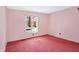 Simple bedroom with pink walls and carpeting at 6908 Creekridge Trl, Indianapolis, IN 46256