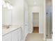 Bathroom with double vanity, walk-in shower, and large closet at 7159 Rose Hill Ave, Brownsburg, IN 46112