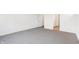 Simple bedroom with grey carpet and access to bathroom at 7159 Rose Hill Ave, Brownsburg, IN 46112