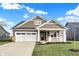 New single-story home with a two-car garage and front porch at 7159 Rose Hill Ave, Brownsburg, IN 46112