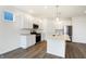 Open concept kitchen with white cabinets and stainless steel appliances at 7159 Rose Hill Ave, Brownsburg, IN 46112