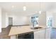 Modern kitchen island with white cabinets and quartz countertops at 7159 Rose Hill Ave, Brownsburg, IN 46112