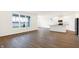 Modern kitchen with island, stainless steel appliances, and vinyl flooring at 7159 Rose Hill Ave, Brownsburg, IN 46112