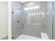 Walk-in shower with glass enclosure and built-in seat at 7159 Rose Hill Ave, Brownsburg, IN 46112