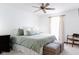 King-size bed, green bedding and stylish ottomans in the main bedroom at 722 Schmitt Rd, Indianapolis, IN 46239