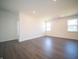 A very large bedroom has multiple windows and wood flooring at 9236 Kavanaugh Dr, Indianapolis, IN 46239