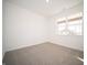 Bright bedroom with soft carpet, a window letting in natural light, and neutral paint at 9236 Kavanaugh Dr, Indianapolis, IN 46239