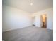 Spacious carpeted bedroom boasts natural light and an ensuite bathroom at 9236 Kavanaugh Dr, Indianapolis, IN 46239