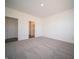 Large carpeted bedroom showcases ensuite bath and walk-in closet at 9236 Kavanaugh Dr, Indianapolis, IN 46239