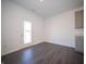 Bright dining area features dark floors, natural light, and a patio door at 9236 Kavanaugh Dr, Indianapolis, IN 46239