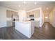 Kitchen with stainless appliances, a large island, and modern cabinetry at 9236 Kavanaugh Dr, Indianapolis, IN 46239