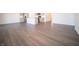 Open-concept living space with wood floors combines the living, dining, and kitchen areas at 9236 Kavanaugh Dr, Indianapolis, IN 46239