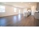 Open-concept living space with wood floors combines the living, dining, and kitchen areas at 9236 Kavanaugh Dr, Indianapolis, IN 46239