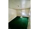 Simple bedroom with green carpet and a window allowing in sunlight at 1125 Laurel St, Indianapolis, IN 46203
