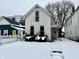 White house exterior in snowy front yard at 1125 Laurel St, Indianapolis, IN 46203