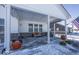 Covered patio with seating area, grill, and snow-covered ground at 19046 Beverly Shones Ln, Noblesville, IN 46062