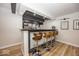 Finished basement bar with sleek design and modern stools at 19046 Beverly Shones Ln, Noblesville, IN 46062