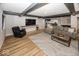 Finished basement with a sitting area and large TV at 19046 Beverly Shones Ln, Noblesville, IN 46062