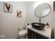 Modern powder room with black vessel sink and gold fixtures at 19046 Beverly Shones Ln, Noblesville, IN 46062