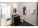 Stylish bathroom with hexagon tile floor and black vanity at 19046 Beverly Shones Ln, Noblesville, IN 46062