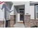 Inviting front entrance with brick columns and a charming wreath at 19046 Beverly Shones Ln, Noblesville, IN 46062