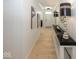 Bright and airy hallway with hardwood floors and modern light fixtures at 19046 Beverly Shones Ln, Noblesville, IN 46062