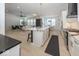 Open concept kitchen with stainless steel appliances and marble countertops at 19046 Beverly Shones Ln, Noblesville, IN 46062