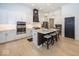 Spacious kitchen with island, stainless steel appliances, and white cabinetry at 19046 Beverly Shones Ln, Noblesville, IN 46062