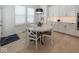 Bright kitchen nook with round table and white chairs at 19046 Beverly Shones Ln, Noblesville, IN 46062