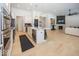 Open floor plan with kitchen, living room, and fireplace at 19046 Beverly Shones Ln, Noblesville, IN 46062