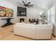 Open concept living room with hardwood floors and a ceiling fan at 19046 Beverly Shones Ln, Noblesville, IN 46062