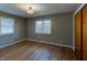Bedroom with wood floors, two windows, and a closet at 2010 N Irwin St, Indianapolis, IN 46219
