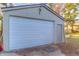 A detached garage with a large door and side access provides convenient parking and storage at 2010 N Irwin St, Indianapolis, IN 46219