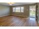 Inviting living room with hardwood floors, neutral walls, and a large window offering plenty of sunshine at 2010 N Irwin St, Indianapolis, IN 46219