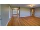 Spacious living room boasts gleaming hardwood floors and a large window for ample natural light at 2010 N Irwin St, Indianapolis, IN 46219