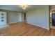 Open-concept living room with gleaming hardwood floors offers versatile layout options and seamless flow at 2010 N Irwin St, Indianapolis, IN 46219