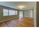 Bright living room with hardwood floors, freshly painted neutral walls, and abundant natural light at 2010 N Irwin St, Indianapolis, IN 46219