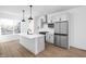 Modern kitchen with island, stainless steel appliances, and white cabinets at 2145 N College Ave, Indianapolis, IN 46202