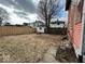 Fenced backyard with a grassy area and a fire pit at 2607 E 12Th St, Indianapolis, IN 46201