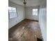 Bedroom with hardwood floors and two windows at 2607 E 12Th St, Indianapolis, IN 46201