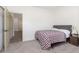 Bedroom with a bed, nightstand, and access to hallway at 2811 Grandview Ln, Greenwood, IN 46143