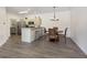 Open concept dining area and kitchen with wood flooring at 2811 Grandview Ln, Greenwood, IN 46143