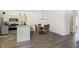 Bright dining area with wood table and chairs, adjacent to kitchen at 2811 Grandview Ln, Greenwood, IN 46143