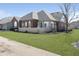 Lovely brick house showcasing well-kept landscaping, white picket fence, and great natural light at 2811 Grandview Ln, Greenwood, IN 46143