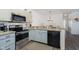 Modern kitchen with stainless steel appliances and granite countertops at 2811 Grandview Ln, Greenwood, IN 46143